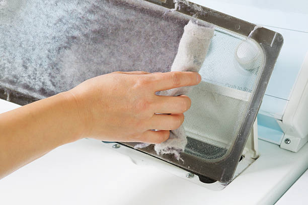 istock Taking the lent of Dryer Machine 472032305