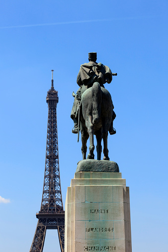 Paris, France - June 7, 2013: equestrian statue of Joseph Jacques Cesaire Joffre (1851-1932), a French general during World War I who defeated the Germans at the First Battle of the Marne, with the Eiffel Tower in the background. This 1939 monument by artist Maxime Real del Sarte monument is located in front of the Ãcole Militaire on the Champs de Mars