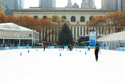 New York City, United States - December 4, 2012: Christmas Decoration at Bryant Park with people skiing