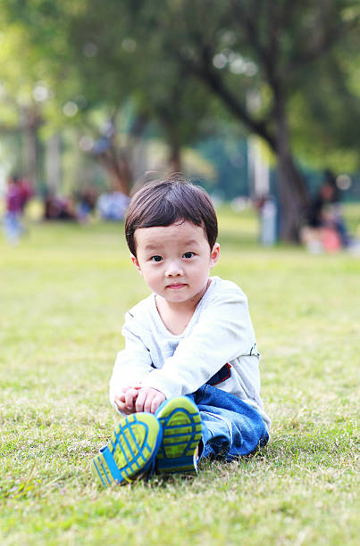 istock Cute children playing in the park 472033021
