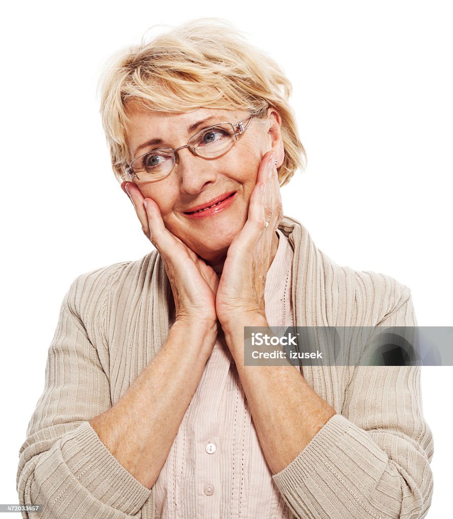 Senior woman Portrait of smiling senior woman. Studio shot, white background. 60-69 Years Stock Photo