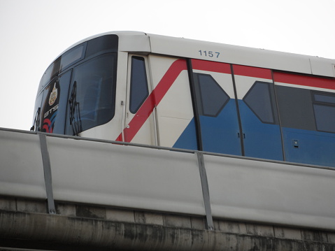 Bangkok, Thailand – January 12, 2013: The view of  BTS (Bangkok Transit System) Skytrain from a sidewalk in Bangkok, Thailand. It is an alternative mode of transportation for people living and working in Bangkok. 