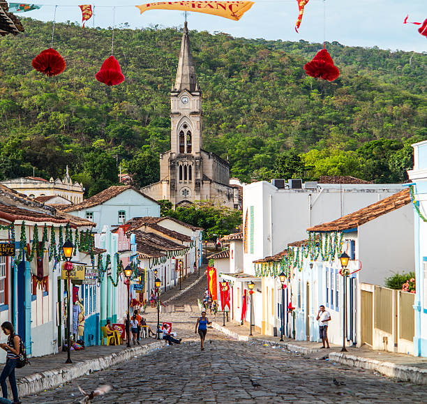 View to old town with church Goias, Brazil - October 17, 2013: people on a cobblestone street in the Unesco world heritage site  in Goias, Brazil. View to old church Igreja do Rosario from 1732. goias photos stock pictures, royalty-free photos & images