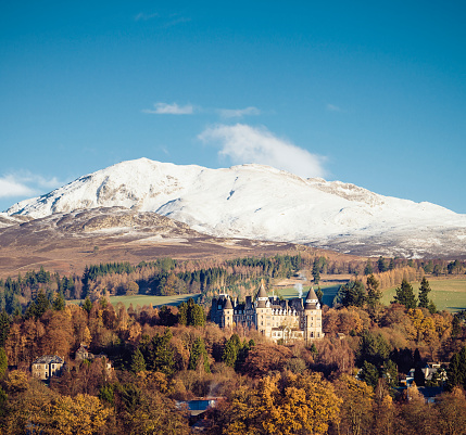 Pitlochry, Scotland, UK - November 22, 2013: The  Atholl Palace Hotel in Pitlochry, with recently fallen snow on the hills beyond the hotel.
