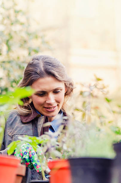 istock Young woman urban gardening 472035773