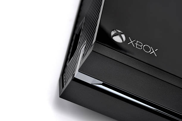 xbox one console detail Forest Row, East Sussex, United Kingdom - Novemeber 25th, 2013: Xbox One console logo. Shot in home studio on white. brand name games console stock pictures, royalty-free photos & images