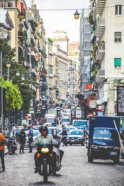 Naples, Italy - October 7, 2011: Busy traffic on streets of central Naples. People living everyday life.