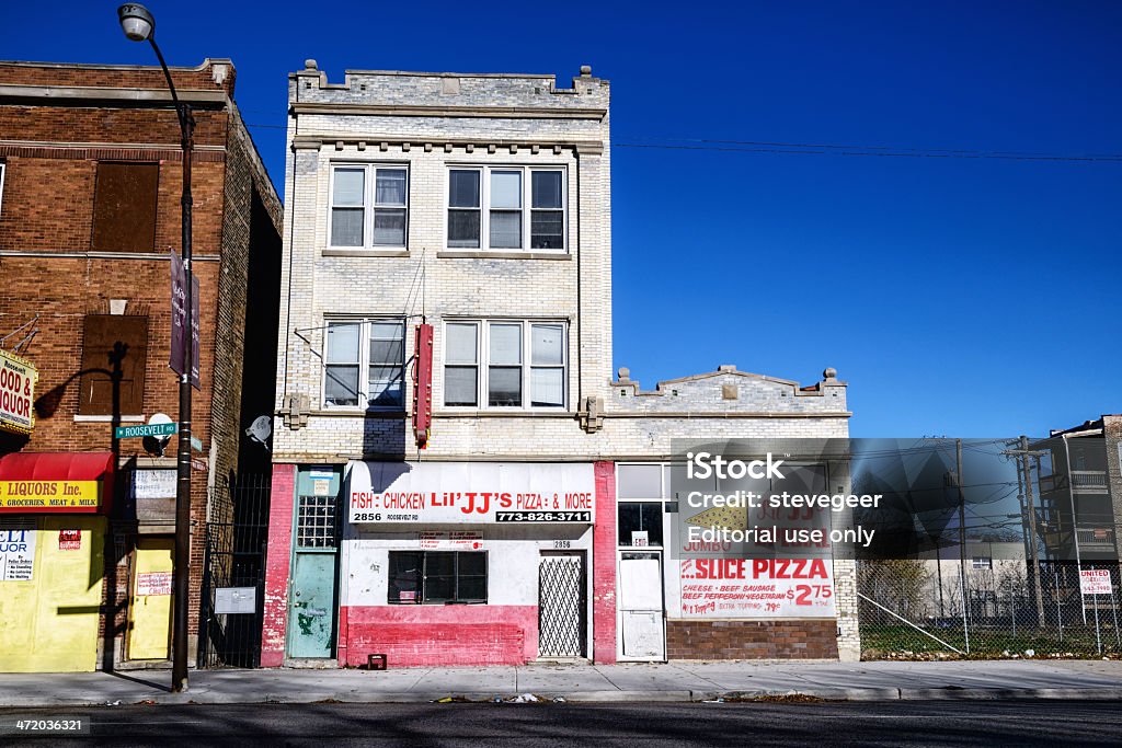 Former Cobra Records studio in Chicago Chicago, USA - November 24, 2013: Former Cobra Records studio at 2854 West Roosevelt Road in North Lawndale, a Chicago community on the West Side. Now a takeout fast food restaurant, Lil JJ's Pizza and More. Old commercial building facade. No people. Architectural Feature Stock Photo
