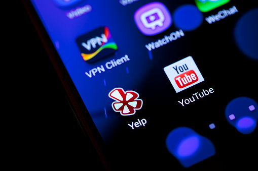 New York City, USA - October 22, 2013: Close-up view of Youtube app and with some other phone app on a smart phone. YouTube is the world's most popular online video community, allowing millions of people to explore, watch and share original video content.