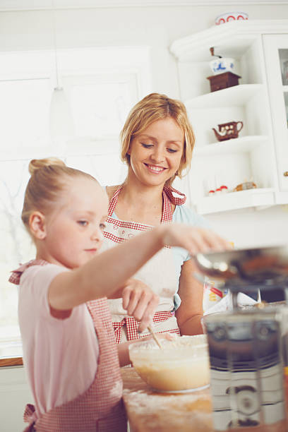 istock So proud of her little baker! 472037159