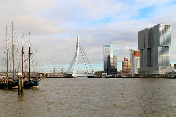 Rotterdam, The Netherlands - November 25, 2013: City skyline of Rotterdam, skyscraper The Rotterdam and Erasmus Bridge on September 25, 2013 in Rotterdam. Rotterdam is the second largest city in Netherlands and has the largest harbor of Europe.