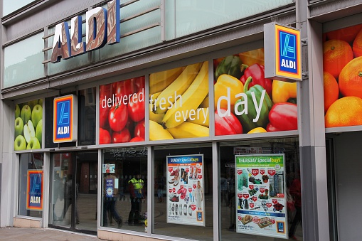Aldi Supermarket on Otford Road in Sevenoaks at Kent, England, with commercial signs visible.