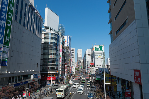 Sapporo, Japan - November 8, 2013 : A busy street with traffic of Shinjuku Station west side district in Tokyo, taken from a footbridge.