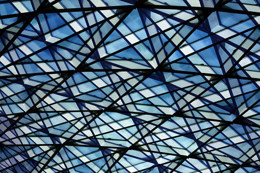 Digitally rendered sketch of a dome, roof or ceiling fragment with an angular pattern structure of all-over glazing. Crossing triangles cause a feeling of futurism, advanced technology, cutting-edge business, success and development.