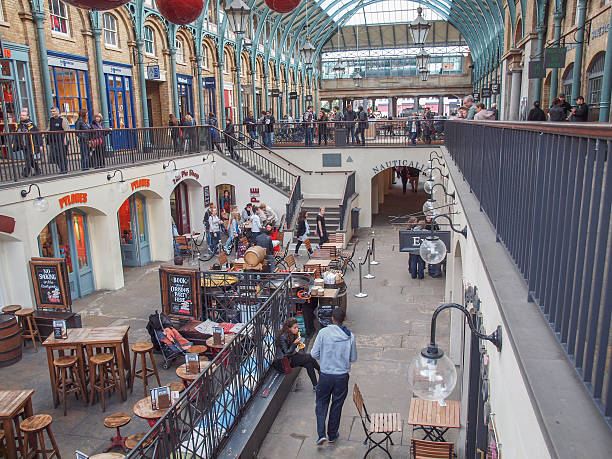 London, United Kingdom - June 14, 2012: HDR image of Covent Garden on a busy afternoon full of people. 