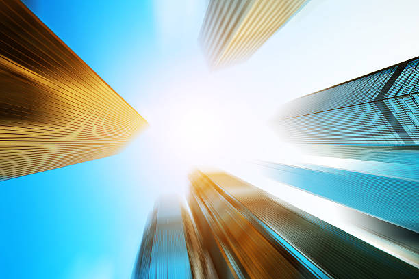 istock low angle view of modern skyscraper in blur motion 472041926