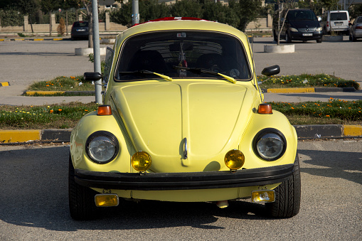 Izmir, Turkey, November 29, 2013: Old fashioned car parked on Izmir street. The Volkswagen Type 1, widely known as the Volkswagen Beetle, was an economy car produced by the German auto maker Volkswagen (VW) from 1938 until 2003 