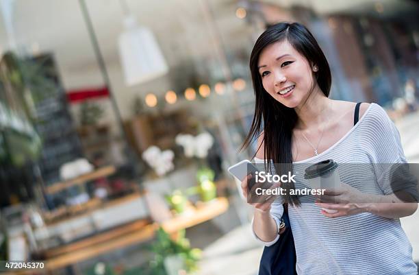 Asian Woman Walking In The City Stock Photo - Download Image Now - Chinese Ethnicity, One Woman Only, Shopping Mall