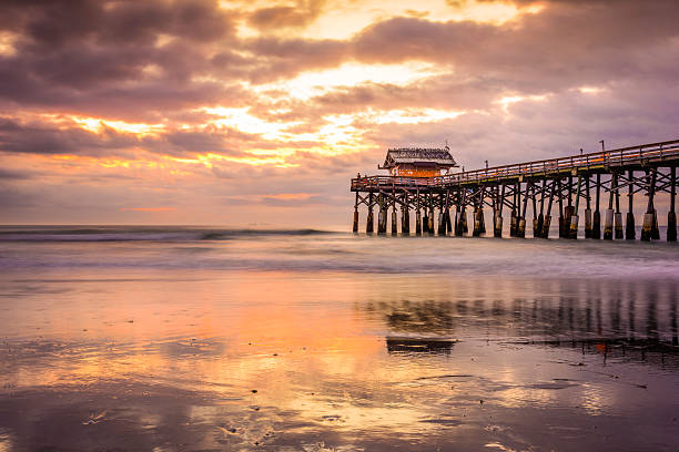 Cocoa Beach Cocoa Beach, Florida, USA beach and pier at sunrise. cocoa beach stock pictures, royalty-free photos & images