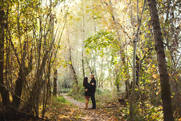 istock Cute Romantic Young Autumn Couple in Nature 472046431