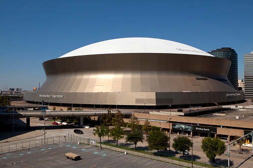 New Orleans,  Louisiana, USA - October 9, 2013: The Mercedes-Benz Superdome  in New Orleans, Louisiana is home to the NFL's  New Orleans Saints American football and NCAA's Tulane University . The Stadium also host  Sugar Bowl , New Orleans Bowl, Bayou Classic college football games. 10 Super Bowls have been played in the statium. The stadium host many other sporting events including baseball, basketball, boxing, soccer, gymnastics and motorcross. 