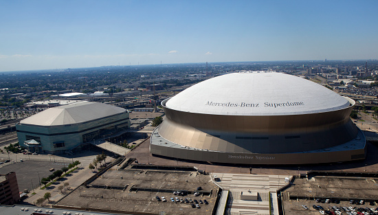 New Orleans,  Louisiana, USA - October 9, 2013:New Orleans Sports and Entertainment Complex (panoramic)  with the New Orleans Arena (left) and the Mercedes-Benz Superdome (right)