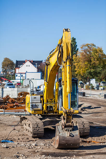 istock Excavator - focus on the arm and bucket. 472047259