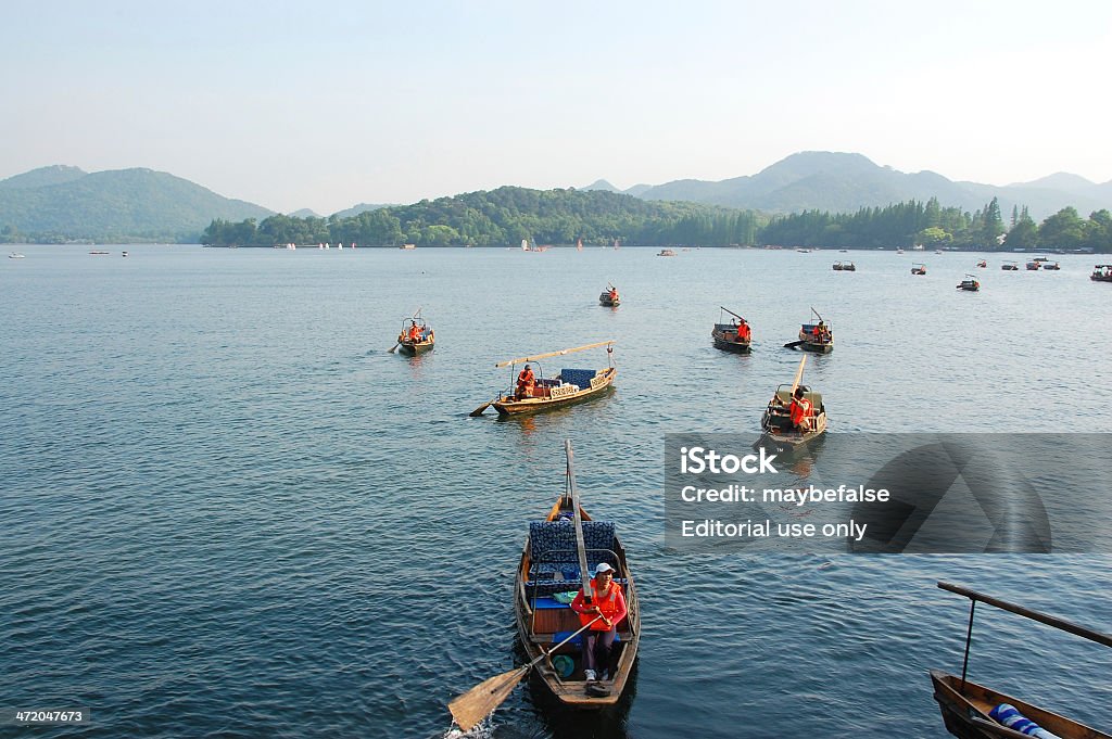 Уэстлейк boatman в Ханчжоу - Стоковые фото West Lake - Hangzhou роялти-фри