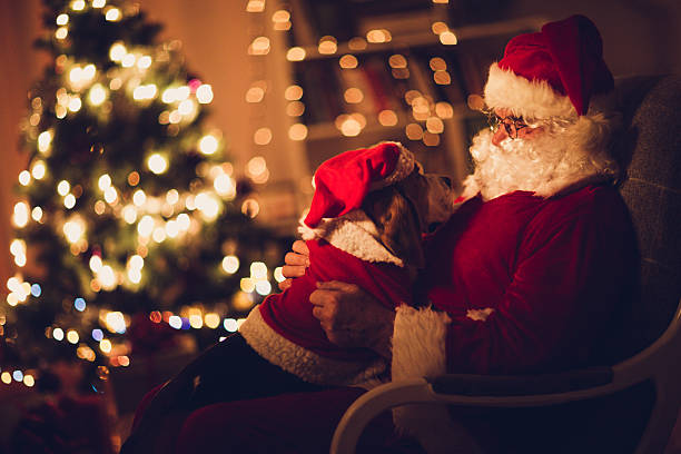 istock Santa Claus and his little helper 472048429