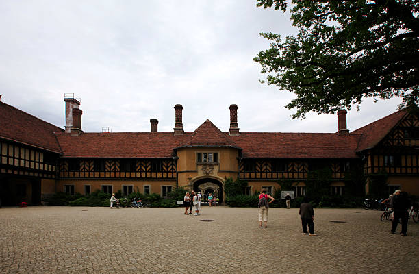 Potsdam, Germany - August 18, 2013: Cecilienhof Palace, built in the style of an English manor house from 1913 to 1917, was the last palace built by the Hohenzollern family. Designed by Paul Schultze - Naumburg, it served the family of Crown Prince Wilhelm as a residence until 1945. It was named after his wife Crown Princess Cecilie.