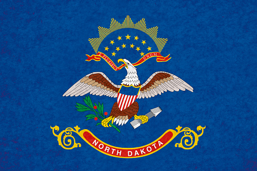 North Dakota flag on mottled paper.