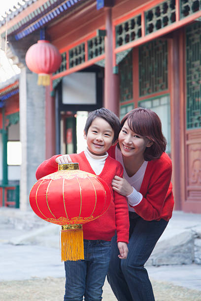 istock Mother And Son Holding Chinese Lantern 472050909