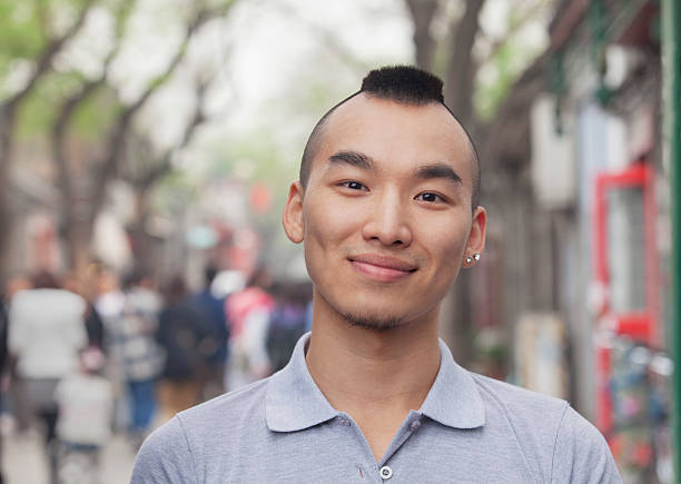 istock Young Man with Mohawk haircut smiling looking at camera 472051277