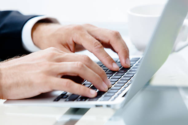 istock Man's hands on the keyboard of laptop 472052245
