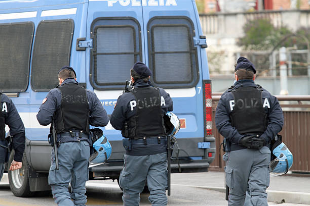 istock roadblock with a van and policemen 472052491
