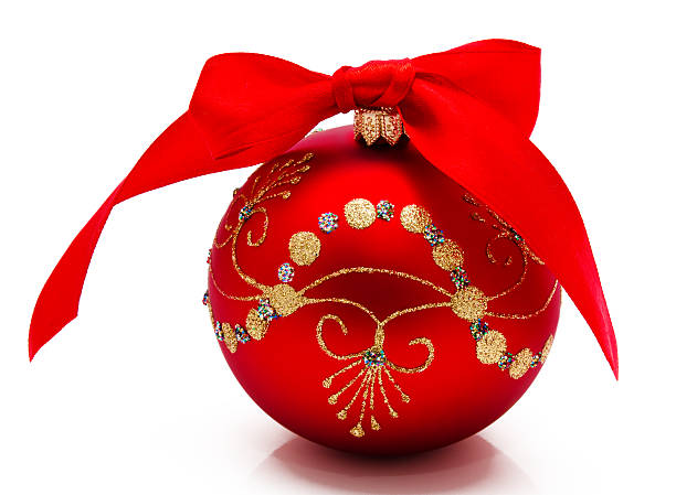 istock Red christmas ball with ribbon isolated on a white 472054695