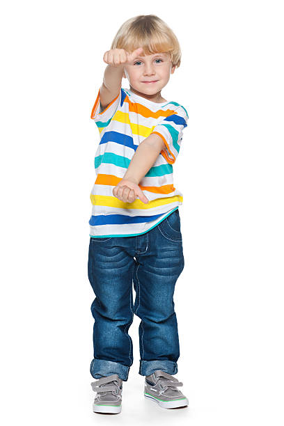 istock Joyful little boy holding his thumbs up 472054937