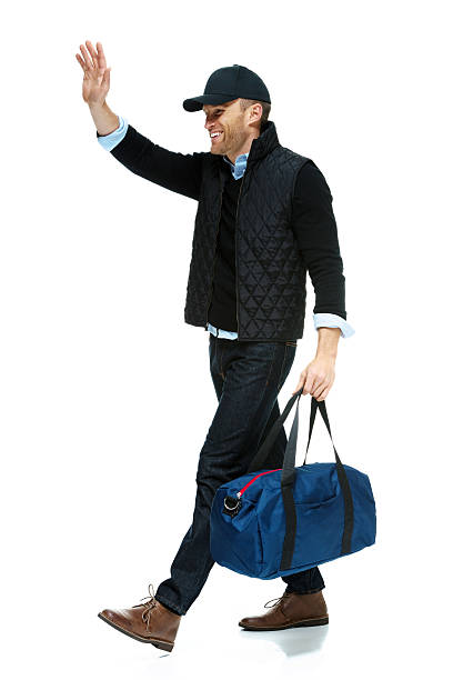 istock Happy man carrying a gym bag 472055917