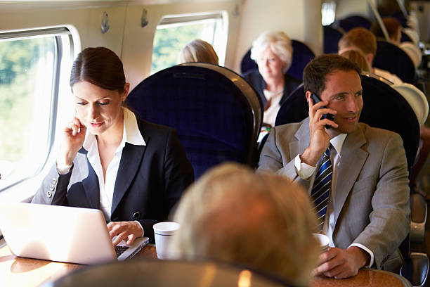istock Businesswoman Commuting To Work On Train And Using Laptop 472056025