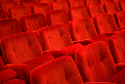Red armchairs in theater