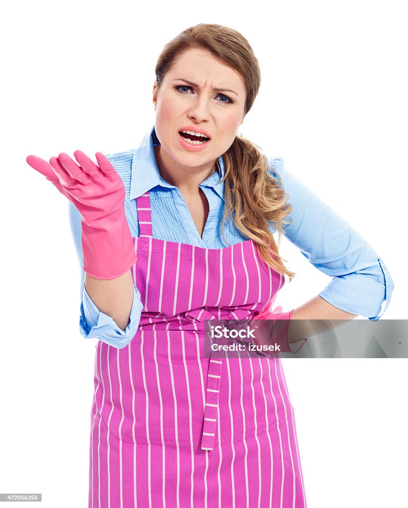 Angry Cleaning Lady Portrait of cleaning lady talking and gesturing with furious at the camera. Studio shot, white background. 30-39 Years Stock Photo