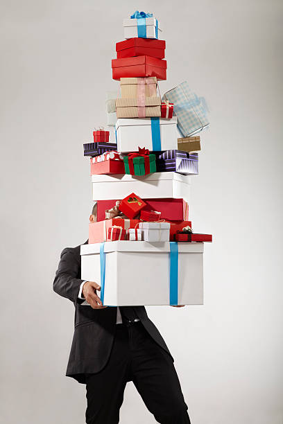 ビジネスマン用のスタックのギフトボックス - christmas stack gift carrying ストックフォトと画像