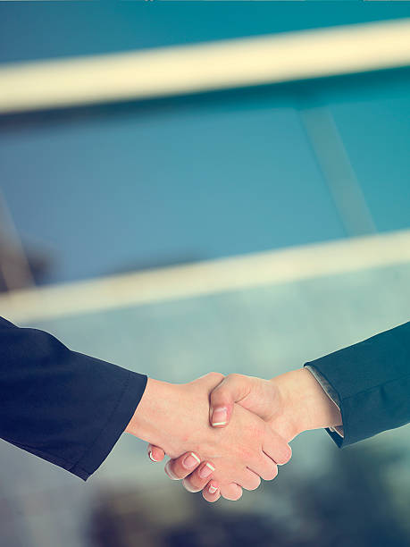 istock Architectural Handshaking in front of building 472057186