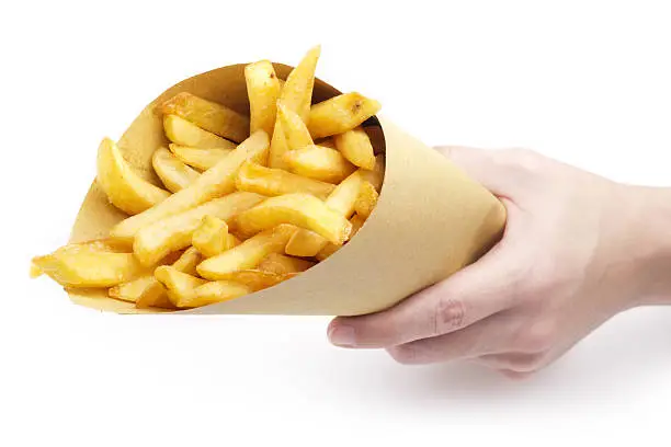 Photo of hand offering fries