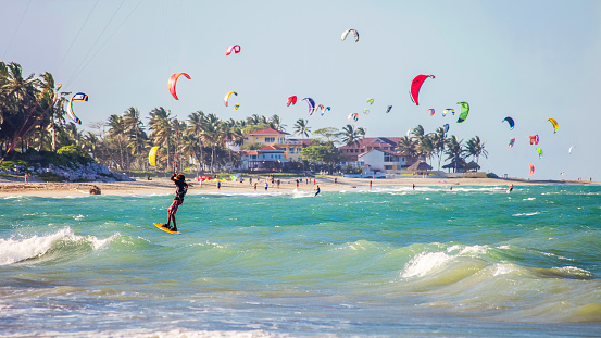 Cabarete, Dominican Republic - February 14, 2009: Kiteboarders enjoying strong wind at popular Cabarete beach on north coast.