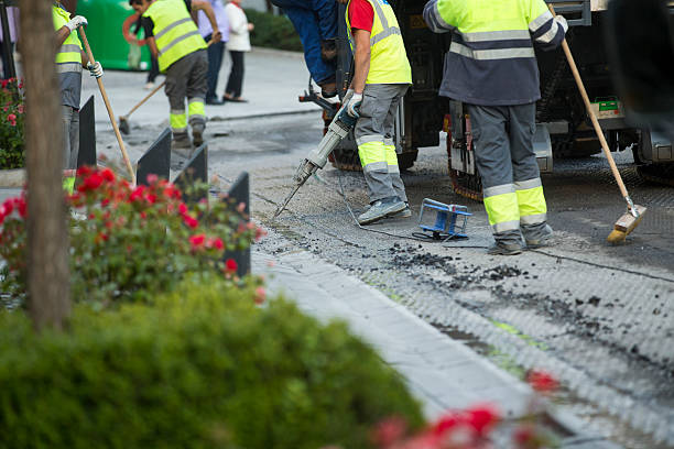 istock Road repairing works with jackhammer 472058096