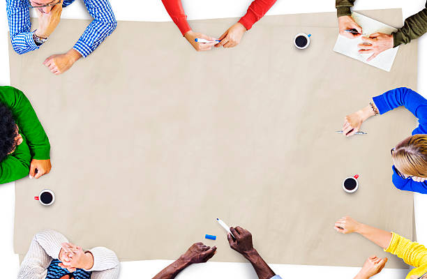 istock A diverse group of people around a table brainstorming 472058312
