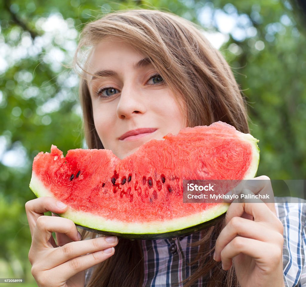 woman and watermelon Young woman with watermelon outdoors. Focus on watermelon Activity Stock Photo