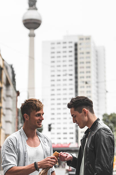 istock friends looking up on alexanderplatz 472058951
