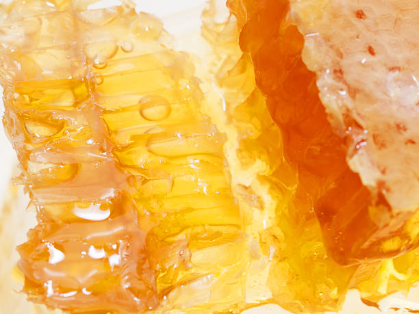 istock golden fresh Honeycomb texture, close up 472059253